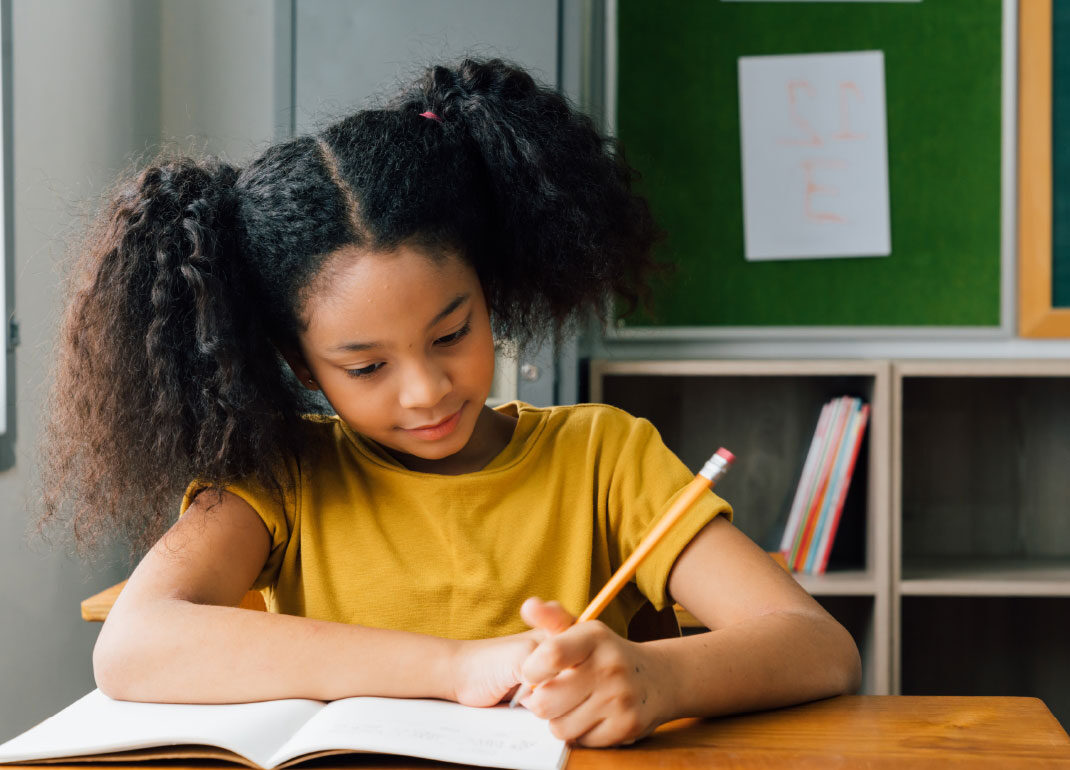 child-writing-in-book